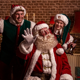The real Santa with Christmas elves