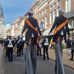 Parade stilt walkers (conductor outfit)