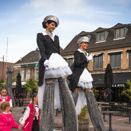 Parade stilt walkers (conductor outfit)