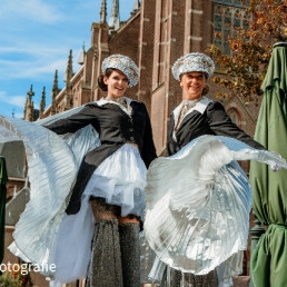 Parade stilt walkers (conductor outfit)