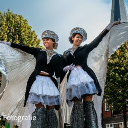 Parade stilt walkers (conductor outfit)