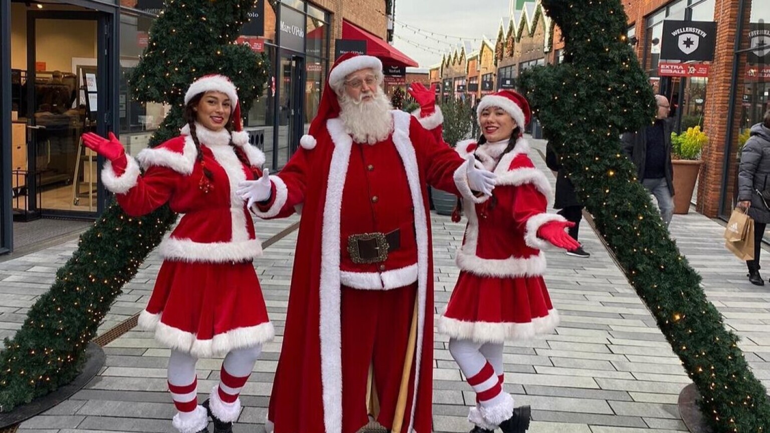 Santa with two Christmas girls for hire